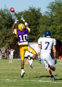 Football player catching a pass.