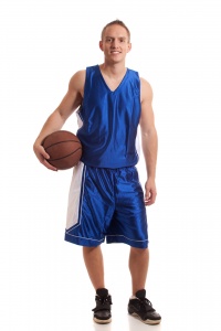 Male basketball player with a ball.