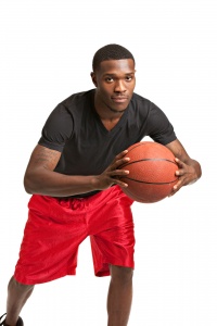 Male basketball player passing a ball