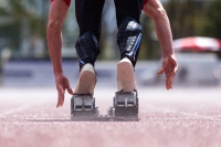 Male sprinter coming out of the blocks
