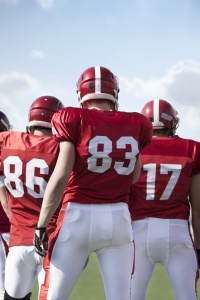 Three football players.