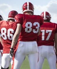 Three football players.