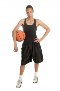 Female basketball player with a ball.